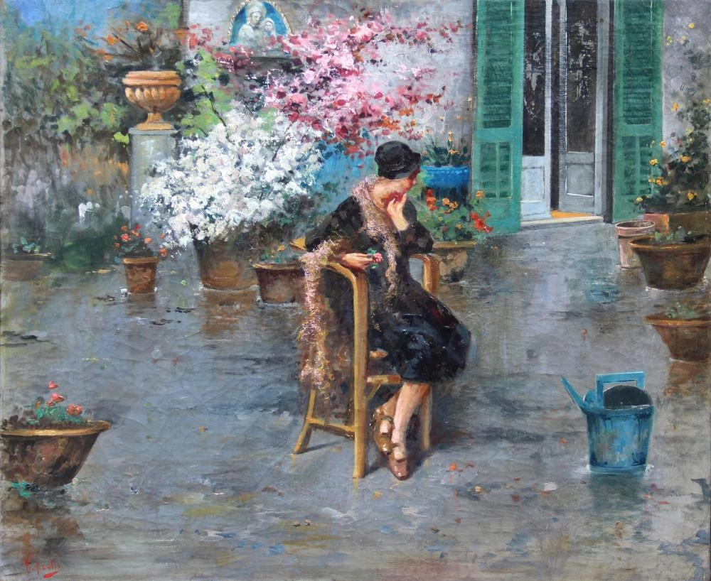 Donna seduta in cortile